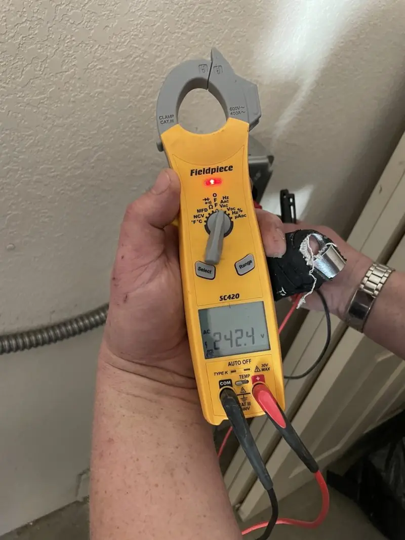 Voltage testing with clamp meter during Electrical Installation Services in Caseyville
